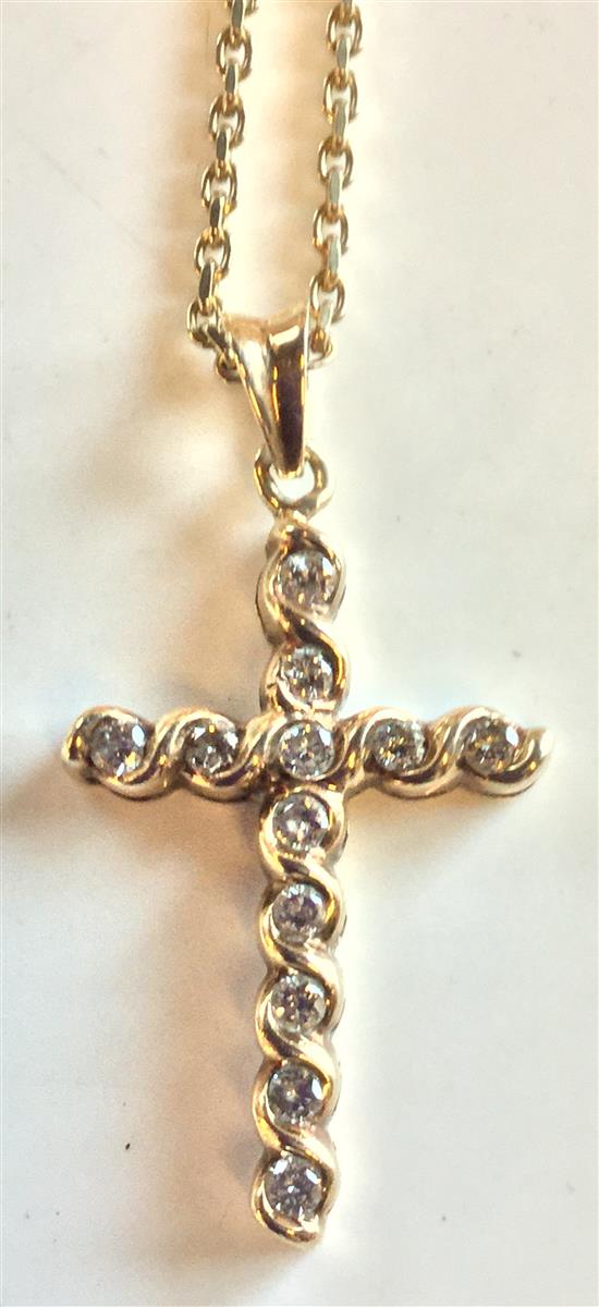 Gold and diamond cross on chain